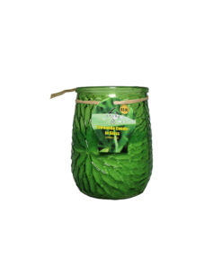 Citronella candle in green glass jar