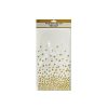 white table cover with gold polka dots